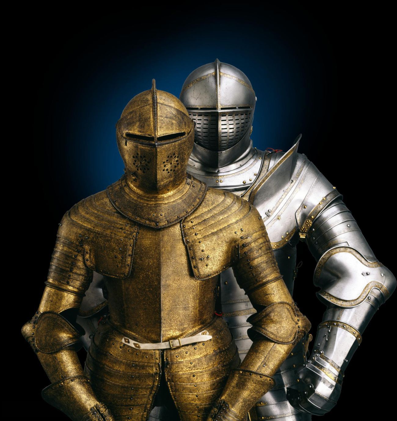 golden armour with the armour of Henry VIII behind