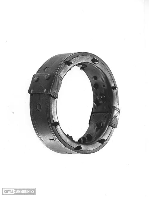 Iron collar photographed against white background