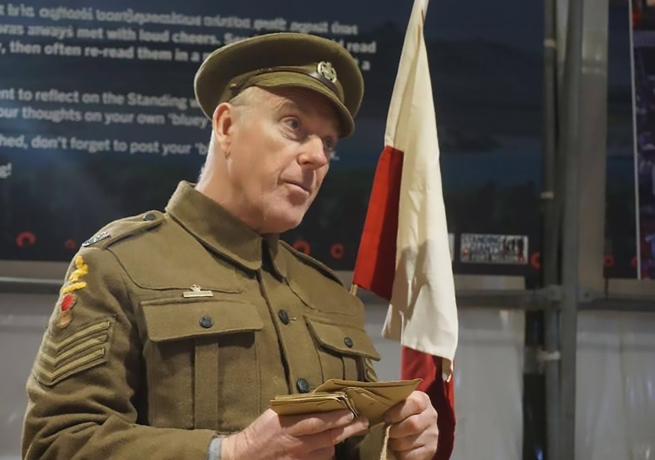 Actor in First World War soldier's uniform reading leters
