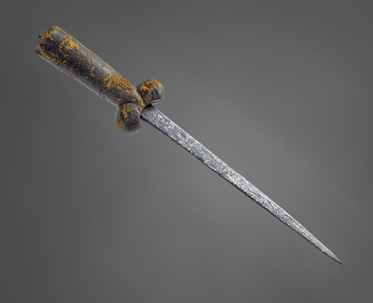 a sharp pointed dagger with a wooden handle