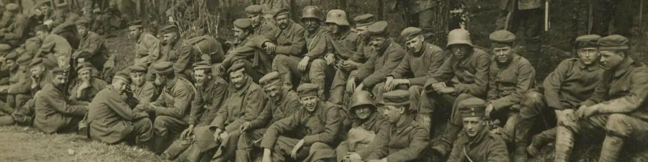A group of German soldiers during the First World War rest on the roadside