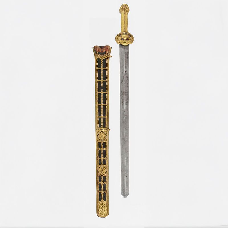 Beautifully decorated sword and scabbard with gold coloured trim