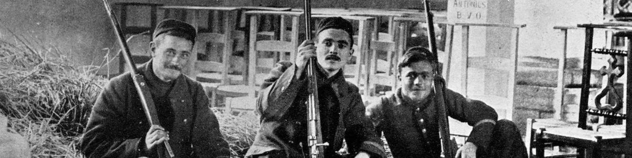 Three Belgian soldiers take a moment of rest inside a church