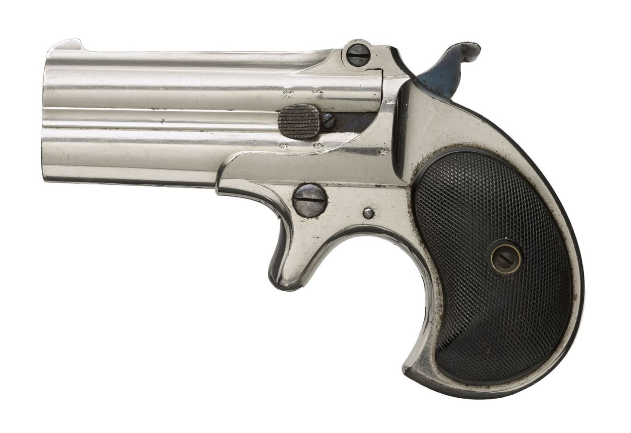 A profile of a small silver pistol