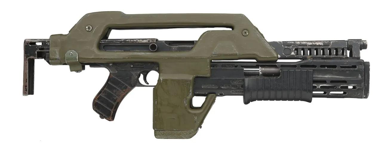 Green plastic and metal Aliens movie prop gun