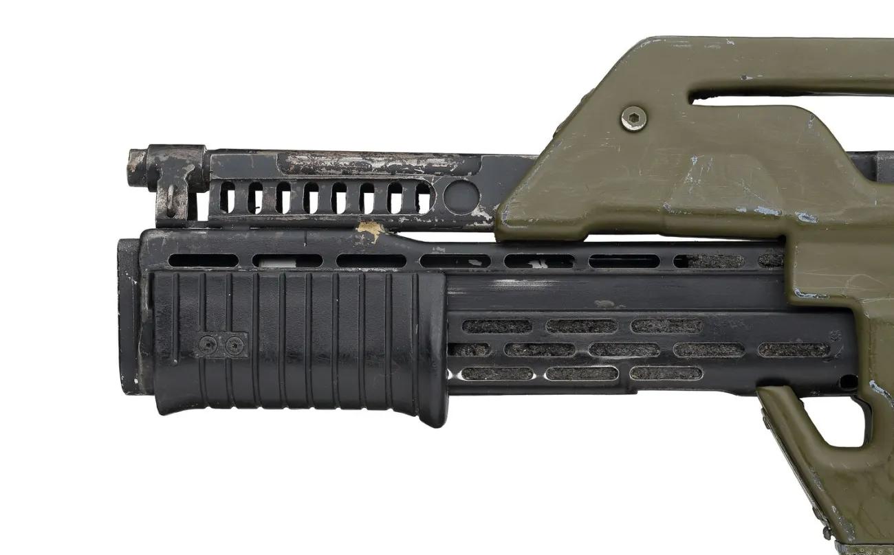 Green plastic and metal Aliens movie prop gun