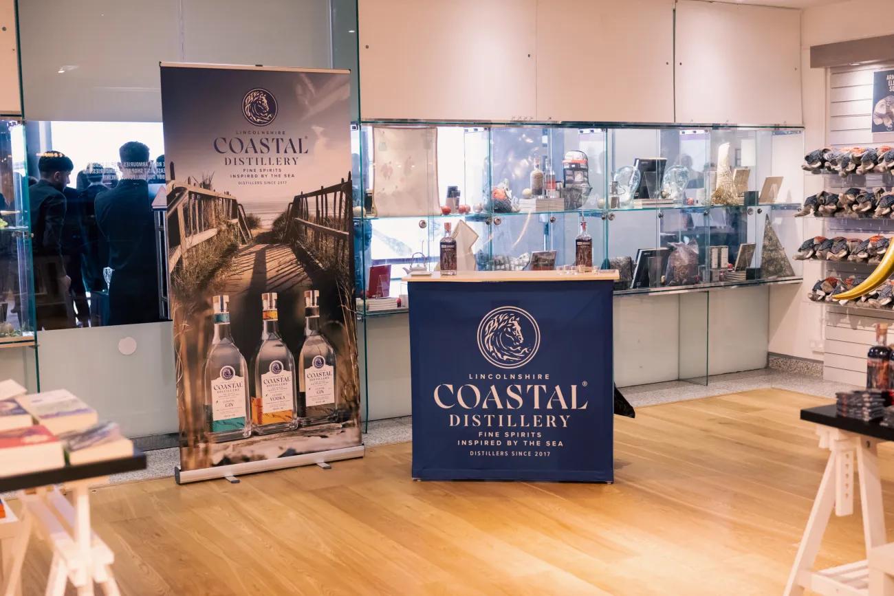 Coastal Gin table and banner in the Royal Armouries museum shop during a product launch