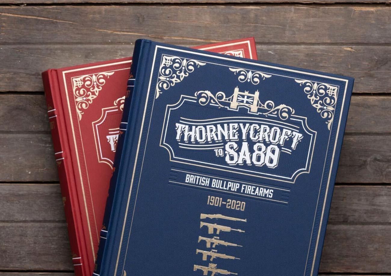 Two Headstamp Publications on wooden table.