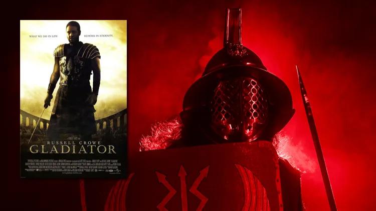 Gladiator film poster showcasing a man in shining armour, poised for combat, with a dark, atmospheric background