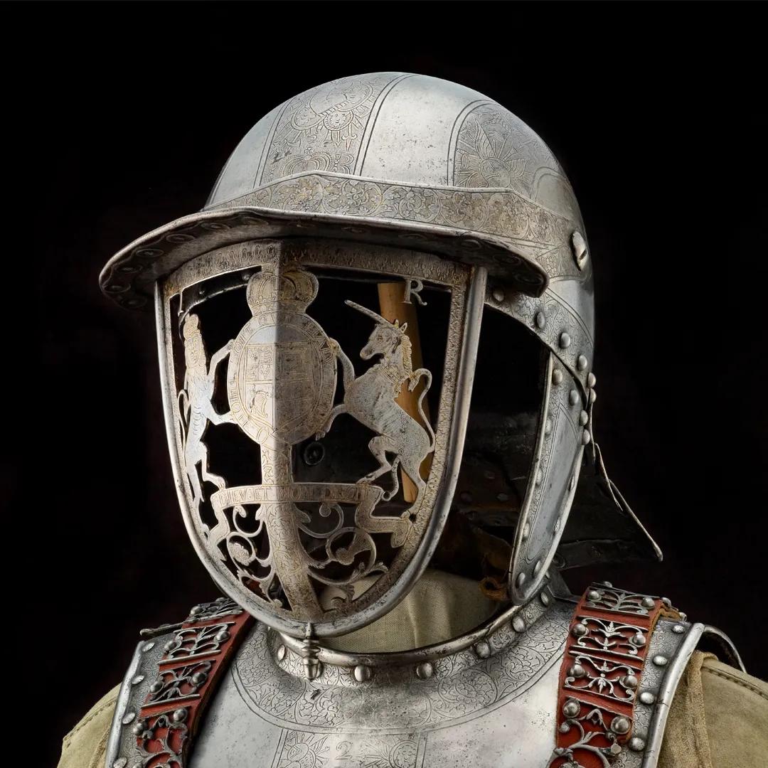 A colour photograph of an ornate helmet in steel
