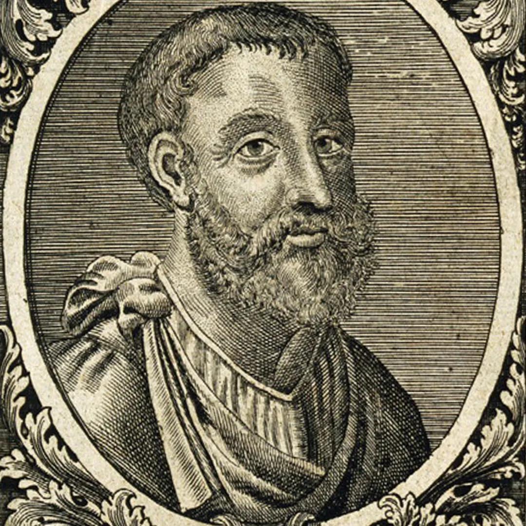 A portrait of a bearded man in robe-like clothing