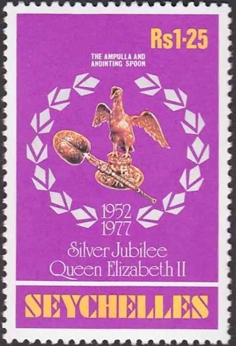 A colour stamp with the words Seychelles and Queen Elizabeth silver jubilee. A gold eagle ampulla and spoon surrounded by white laurels.
