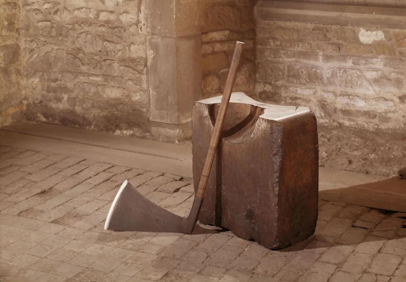 Axe resting against block on cobbled street