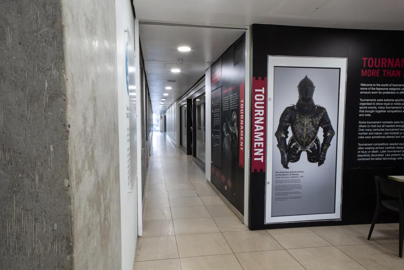 A long corridor with vinyl wall covering showing the way to the tournament gallery