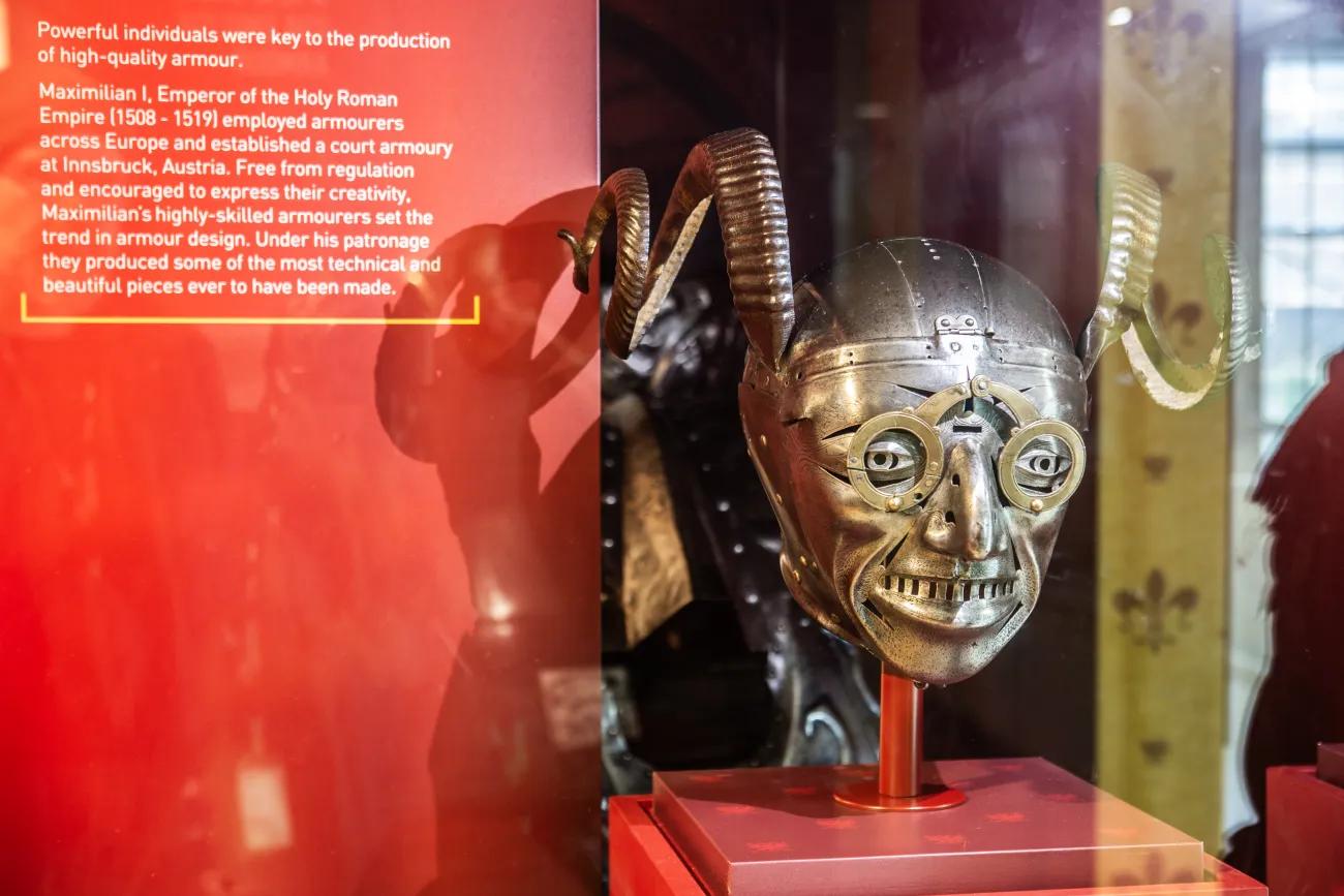 A photo of a distinctive horned helmet with metal spectacles and rictus grin