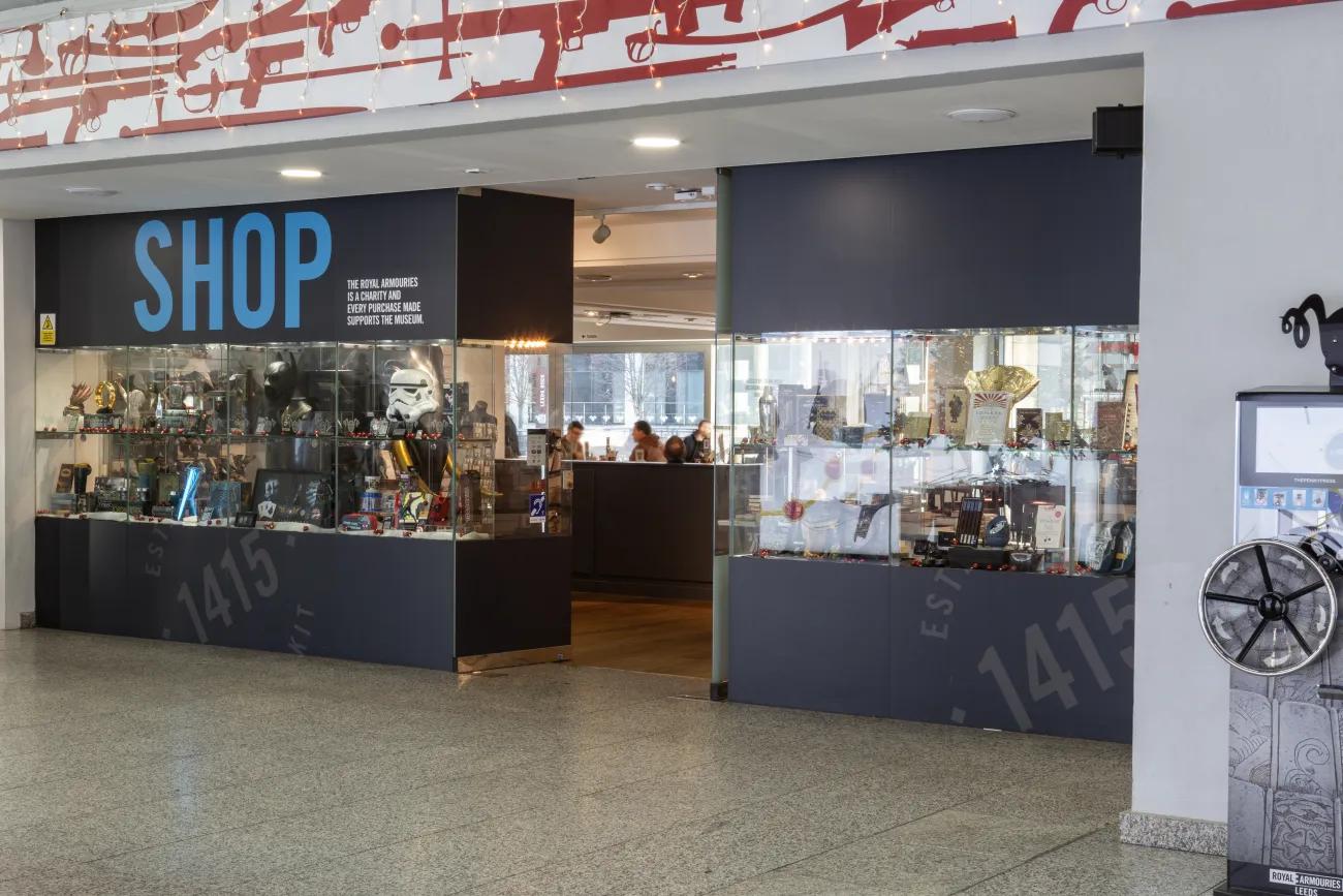 A gift shop fronted in glass with displays of various items in the window