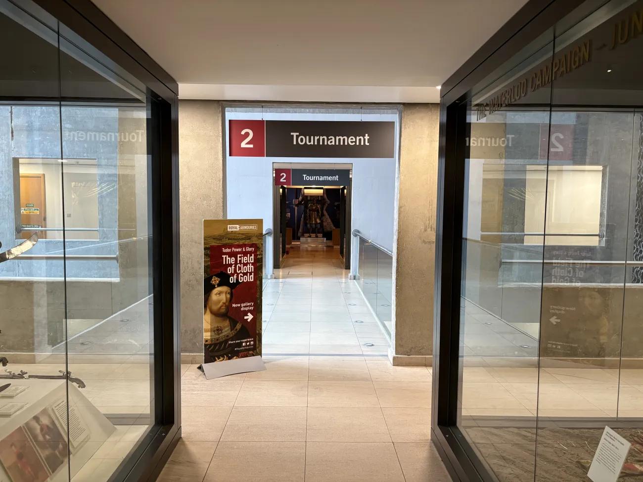 A photo of the entryway to a tournament gallery in steel, glass, and concrete.