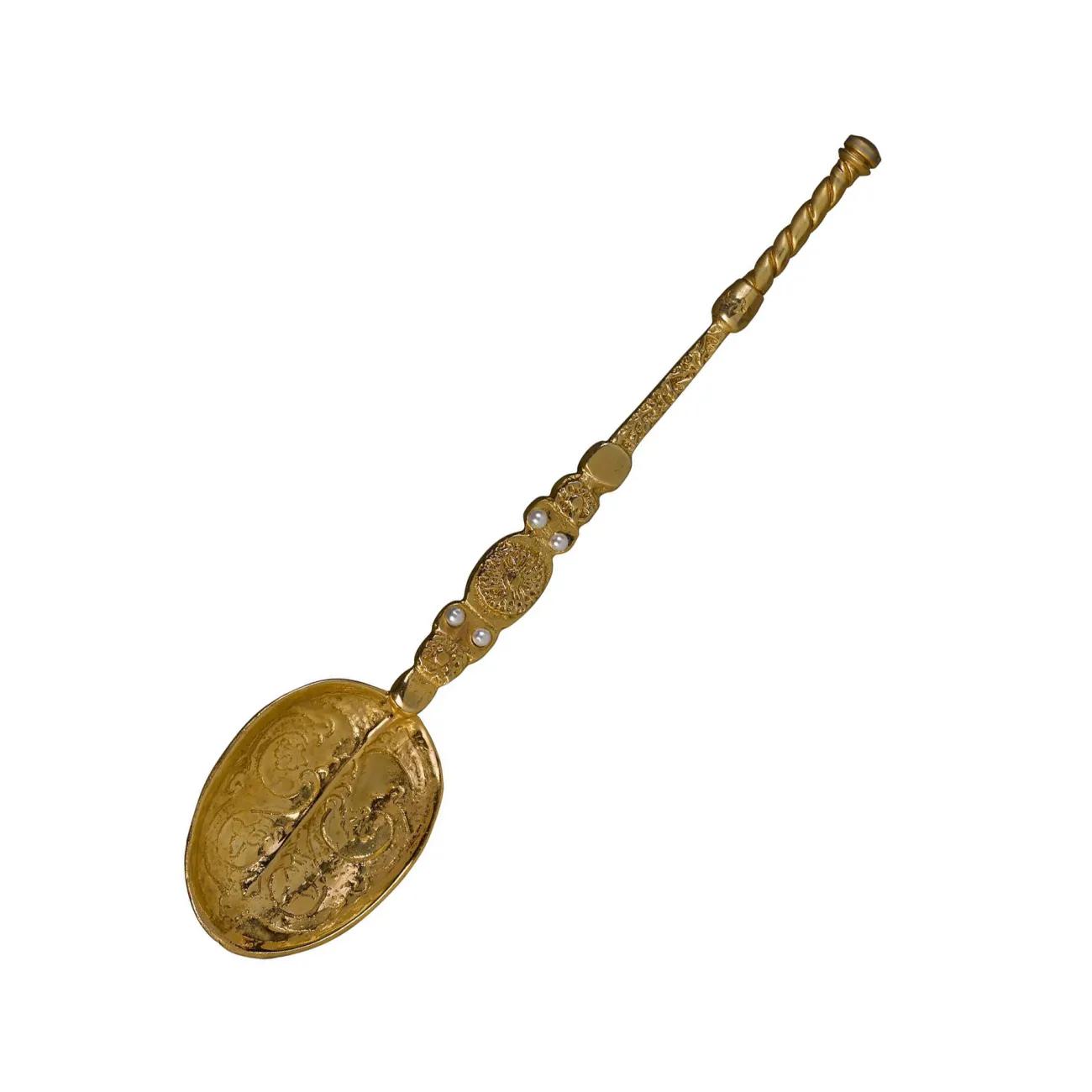 gold coloured metal spoon