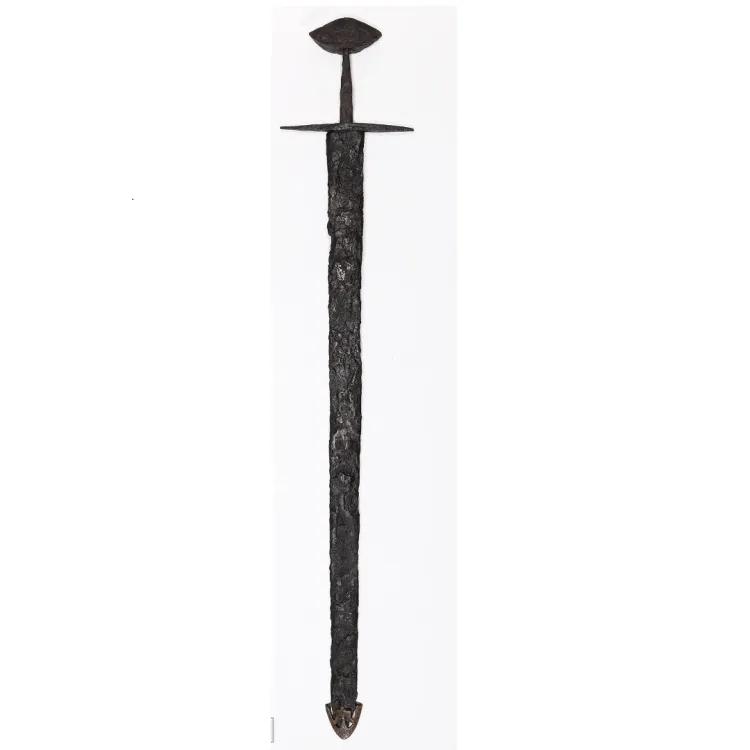 Sword with a brazil nut pommel and copper alloy, shield shaped chape