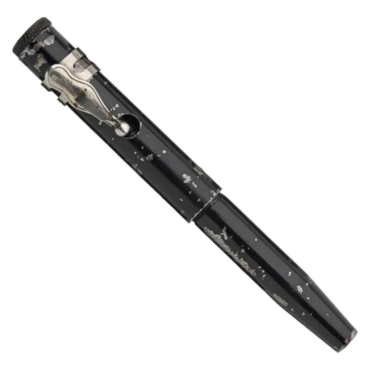 A black Pen that also fired bulleted ammunition