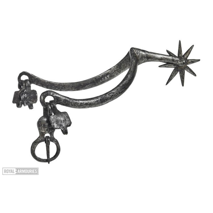 Spur for the left foot with eight-pointed rowel, retaining original hooked tabs and buckle