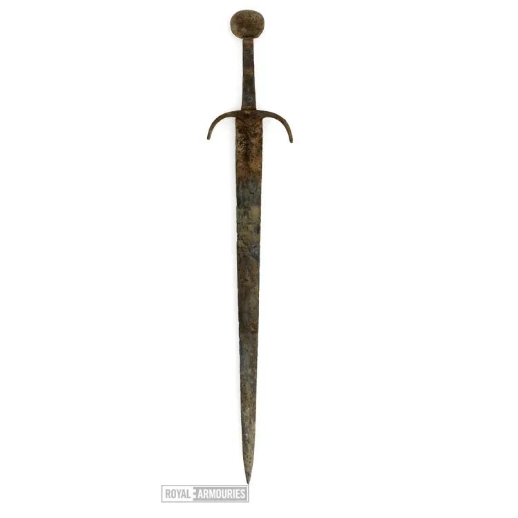 Sword with round pommel and arched cross guard, severely rusted and discoloured.
