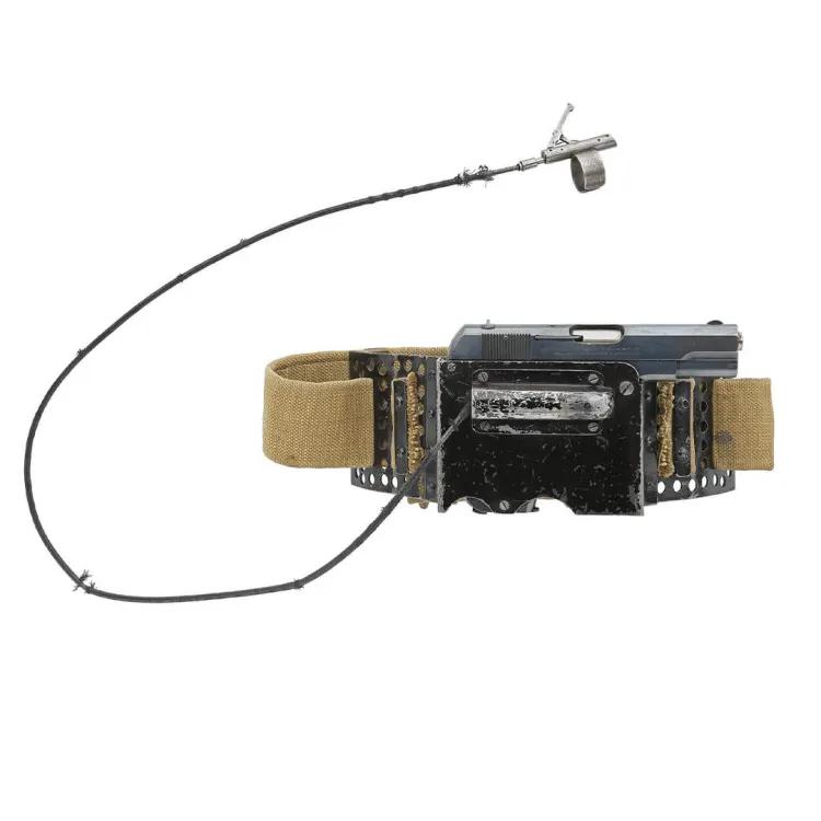 A device with a pistols holstered in a belt strap