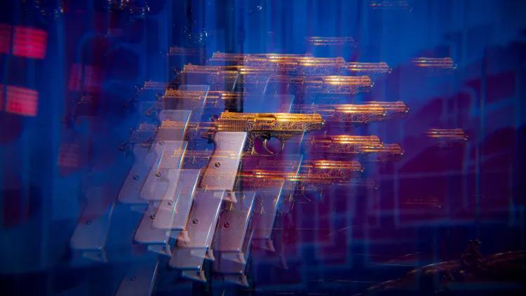 Multiple images of the a pistol overlaid creating a blurred image
