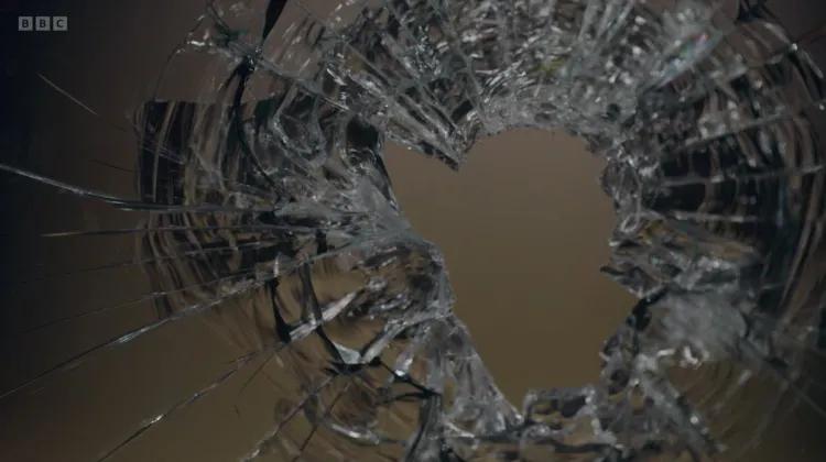 Bullet hole in glass from Killing Sherlock documentary