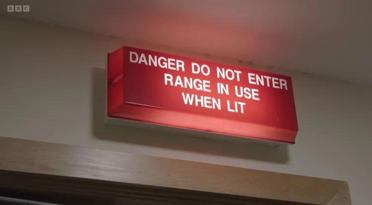 Light above door that reads - Danger do not enter range in use when lit