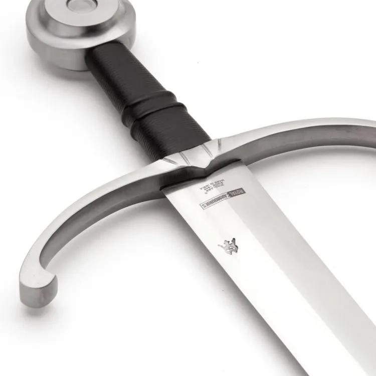 Cropped view of sword with black grip, curving cross guard and disc pommel