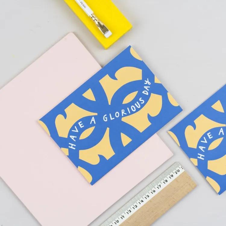 Greetings cards with a ruler and paintbrush