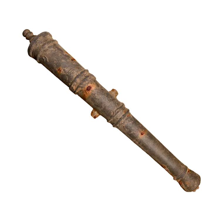 An iron cannon barrel with rusted patches