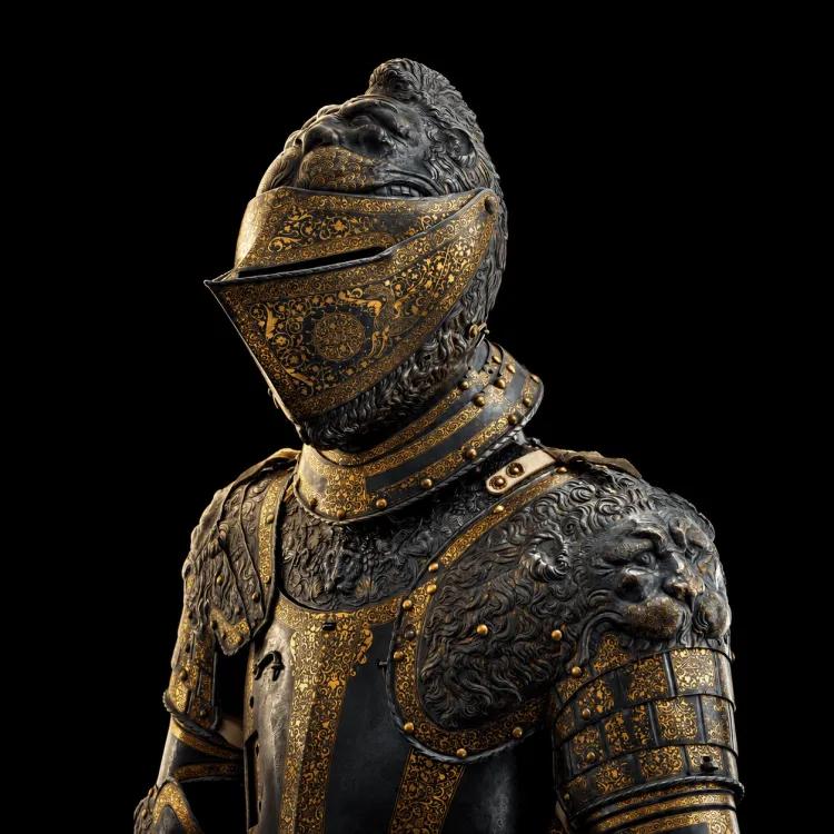 gold decorated armour with the stylised lion faces