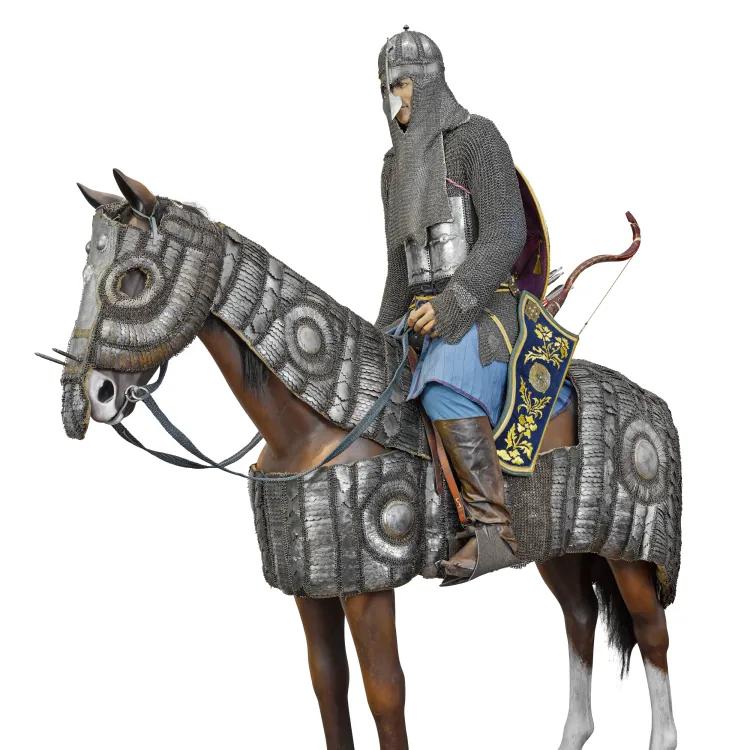 A mannequin of a horse and rider wearing mail and plate armour