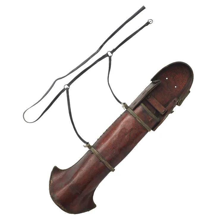 A brown leather case for arrows with brown leather strapping to tie to the body