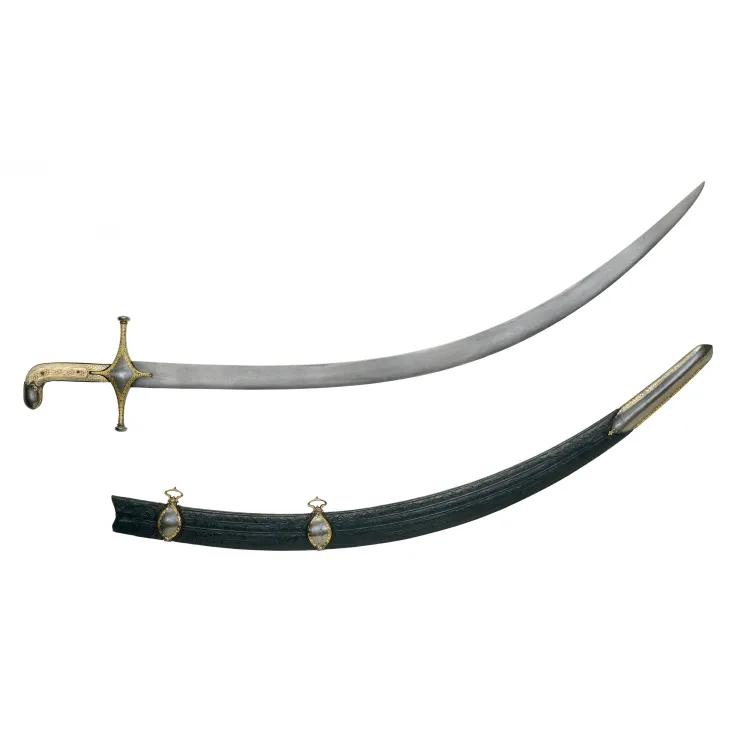 A curved sword with ivory grip and gold ornament with wood scabbard.