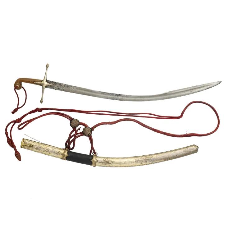 A curved sword with a polished wooden hilt with a metal scabbard wrapped by cord straps